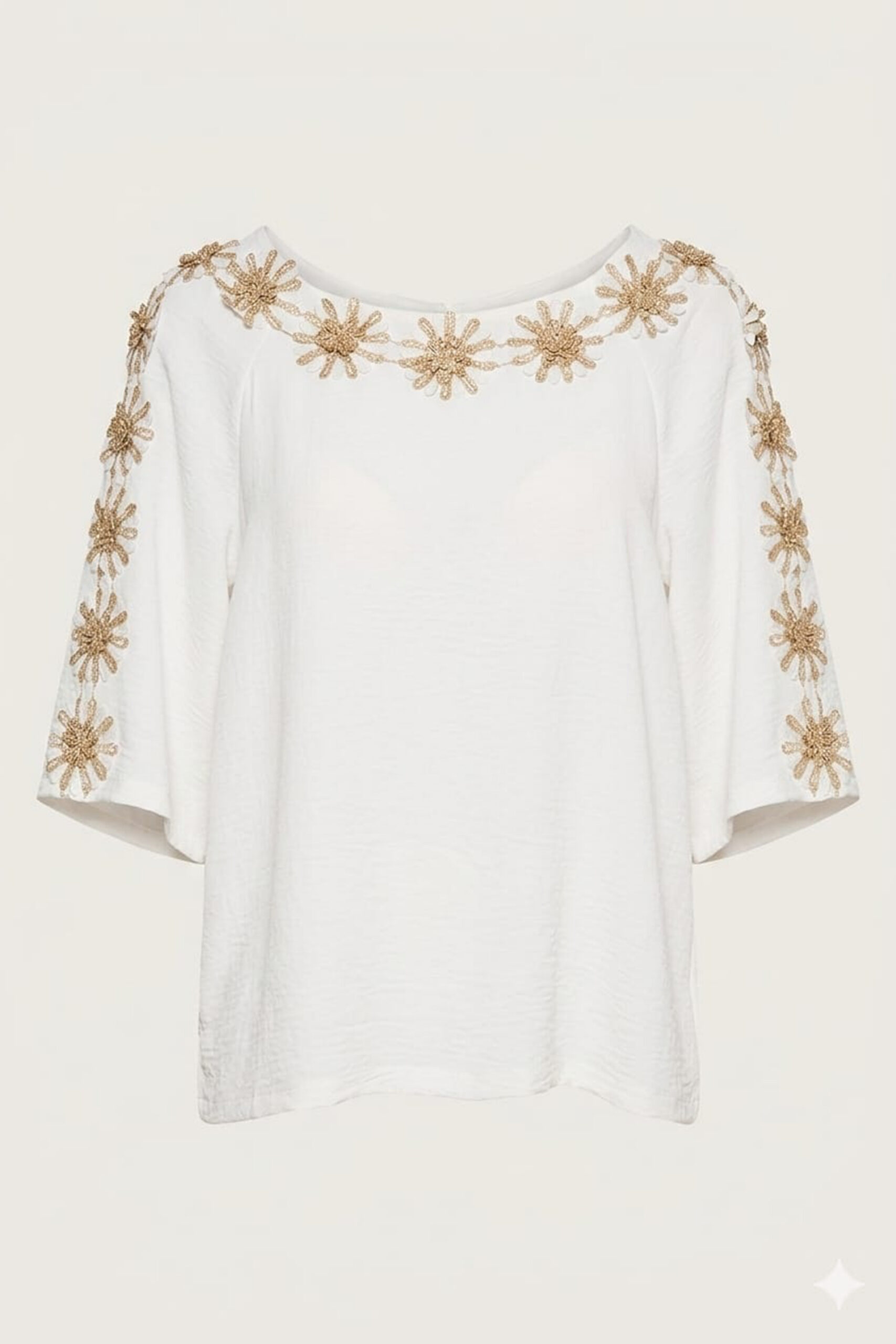 Blusón elegante con apliques florales dorados Anabela